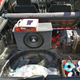 During the installation. A bungee cord between the two shock towers is currently holding the subwoofer box.
